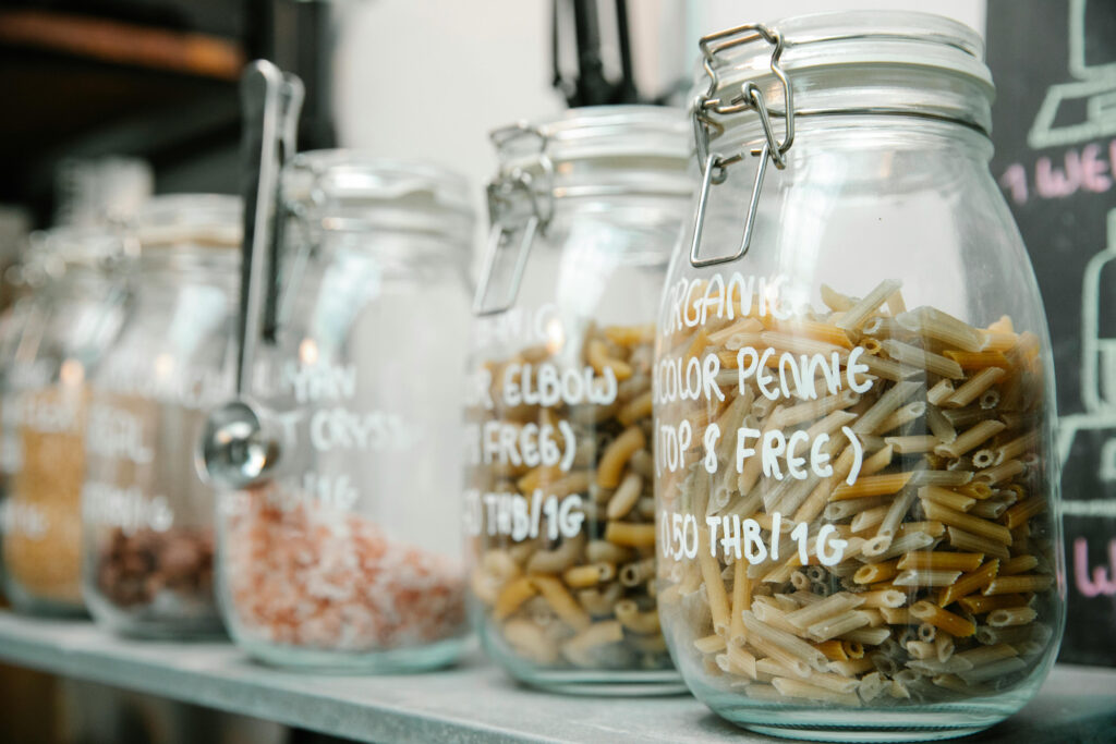 Clear glass storage jar with airtight lid for food pantry organization