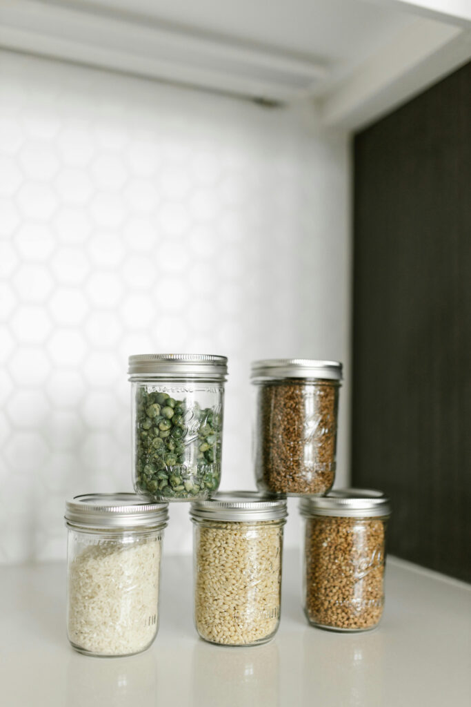 Clear glass storage jar with airtight lid for food pantry